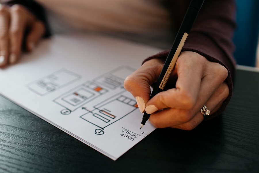 Designer sketching UI wireframes
